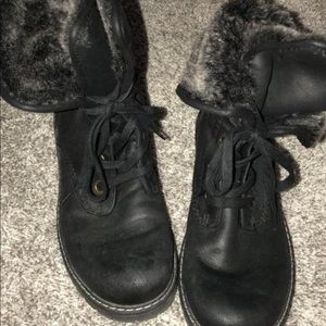 Black combat boots with faux fur lining on inside